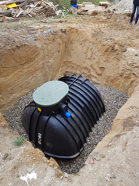 Cistern partially buried in the ground