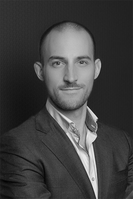 Young man with beard in a suit jacket and dress shirt